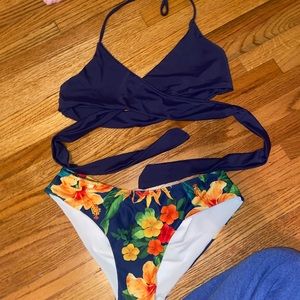 cross top bathing suit with tropical bottoms